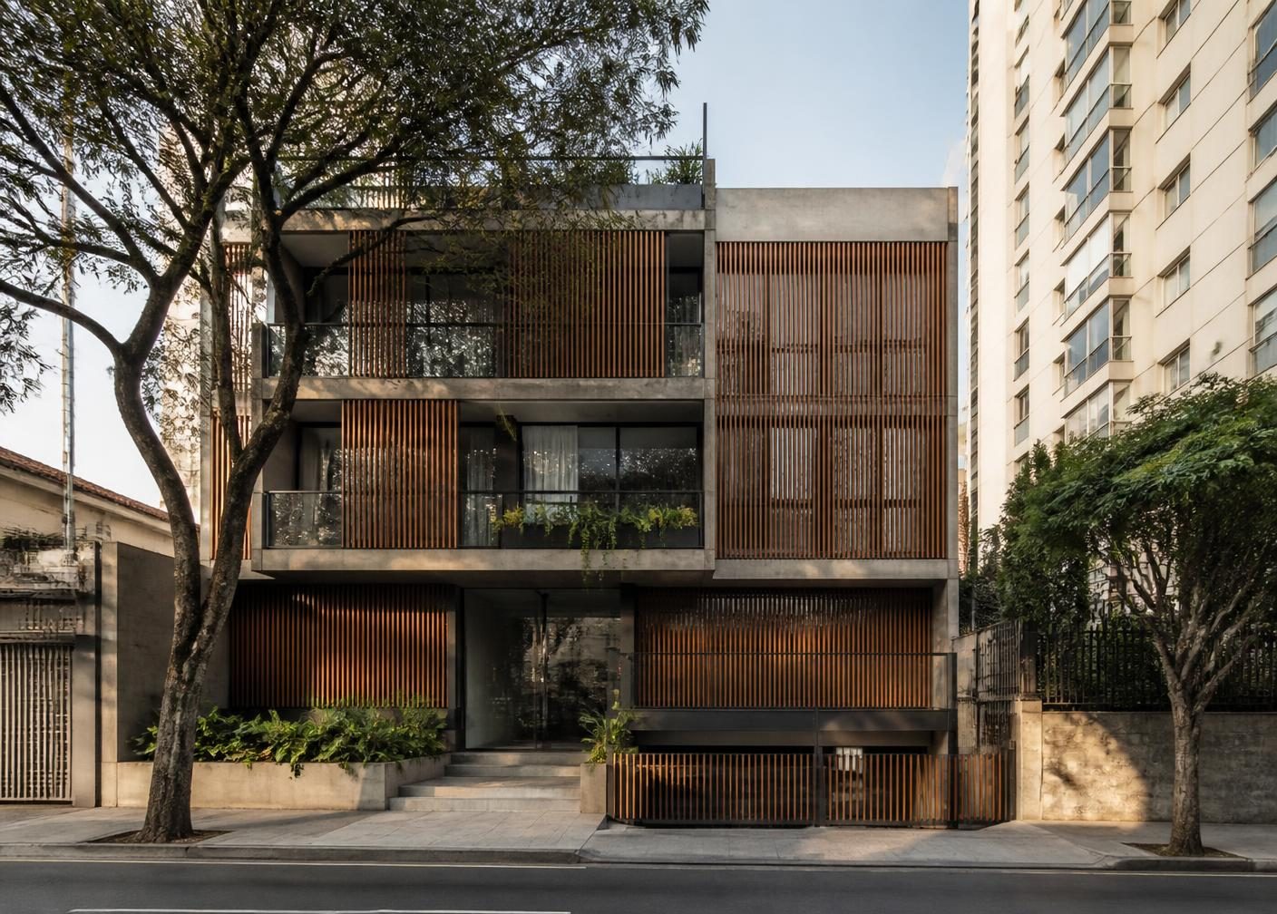 Edifício residencial contemporâneo de pequeno porte em rua arborizada